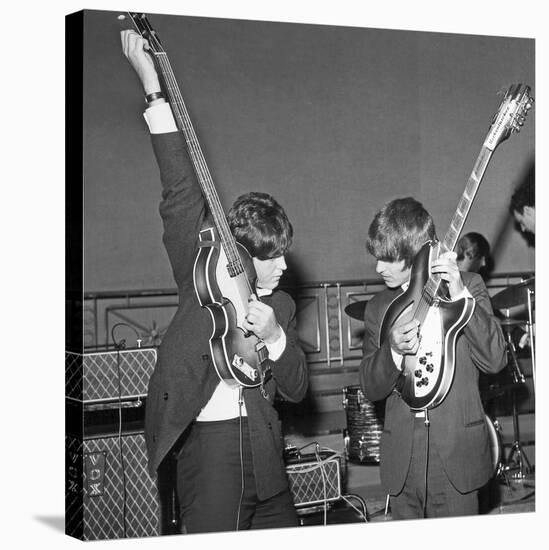 Paul Mccartney and George Harrison Tune their Guitars-Associated Newspapers-Stretched Canvas