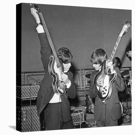 Paul Mccartney and George Harrison Tune their Guitars-Associated Newspapers-Stretched Canvas