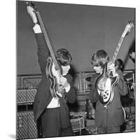 Paul Mccartney and George Harrison Tune their Guitars-Associated Newspapers-Mounted Photo