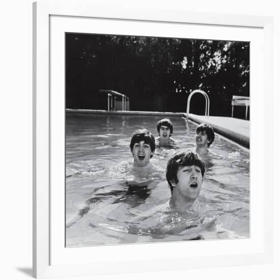 Paul McCartney, George Harrison, John Lennon and Ringo Starr Taking a Dip in a Swimming Pool-null-Framed Photographic Print