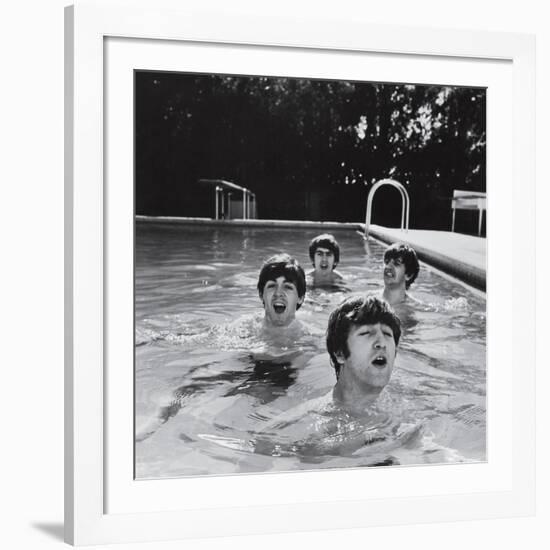 Paul McCartney, George Harrison, John Lennon and Ringo Starr Taking a Dip in a Swimming Pool-null-Framed Photographic Print