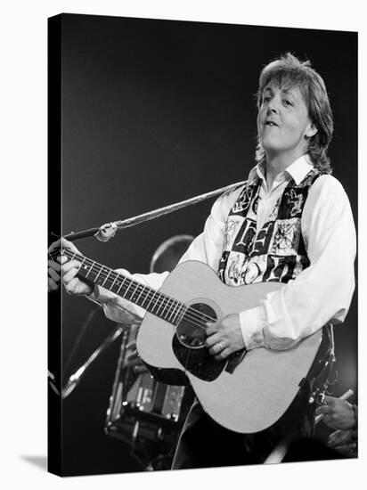 Paul McCartney Playing Guitar on Stage-null-Stretched Canvas