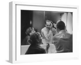 Paul Newman Talking to His Wife Joanne Woodward While Getting Dressed-Gordon Parks-Framed Premium Photographic Print