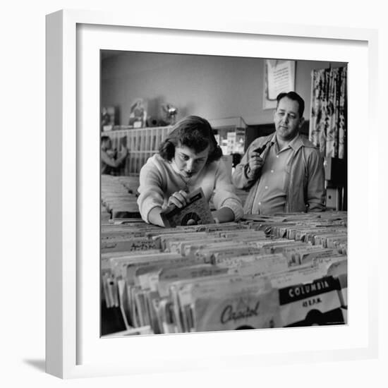 Pay in Trade Taken by High School Music Store Worker Margaret High, Spending Salary on Records-Nina Leen-Framed Photographic Print