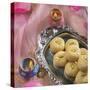 'Peda' an Indian Sweet Made from Condensed Milk. Arranged along with Traditional Lights.-satel-Stretched Canvas
