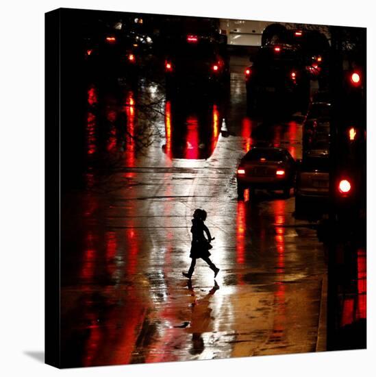 Pedestrian in Rain-Soaked Street in Country Club Plaza Shopping District of Kansas City, Missouri-null-Stretched Canvas