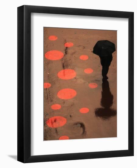 Pedestrian Makes His Way in New York's Times Square in the Rain-null-Framed Photographic Print