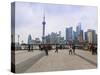 Pedestrians and Tourists on the Bund, the Futuristic Skyline of Pudong across the Huangpu River Bey-Amanda Hall-Stretched Canvas