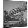 Pedestrians Cross Virginia Street as the Arch That Proclaims Reno: the Biggest Little City-null-Mounted Photographic Print