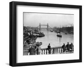 Pedestrians on London Bridge Watch Boats and Barges Being Unloaded-null-Framed Photographic Print