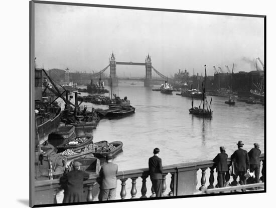 Pedestrians on London Bridge Watch Boats and Barges Being Unloaded-null-Mounted Photographic Print