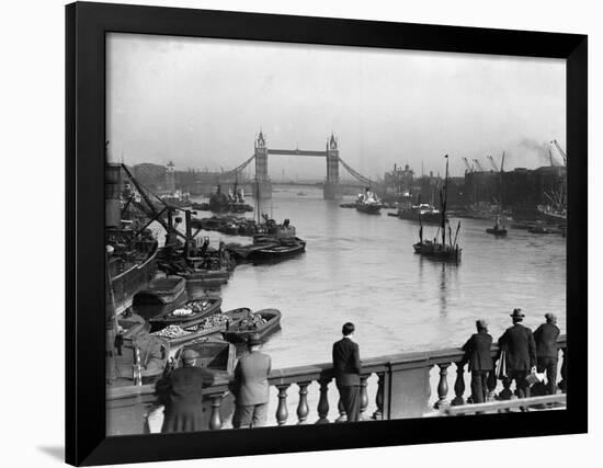 Pedestrians on London Bridge Watch Boats and Barges Being Unloaded-null-Framed Photographic Print