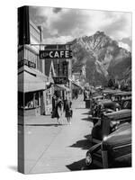 Pedestrians Walking Along Main Street in Resort Town with Cascade Mountain in the Background-Andreas Feininger-Stretched Canvas