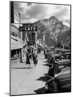 Pedestrians Walking Along Main Street in Resort Town with Cascade Mountain in the Background-Andreas Feininger-Mounted Photographic Print