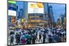 Pedestrians with umbrellas Shibuya Crossing, one of the busiest crossings in the world, Tokyo, Japa-Peter Adams-Mounted Photographic Print