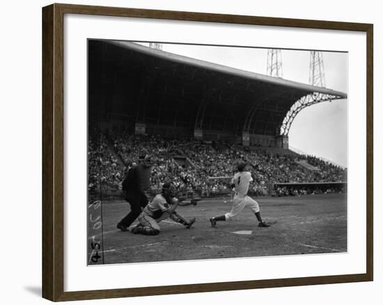 Pee Wee Reese Bats for the Brooklyn Dodgers During a Dodgers-Braves Game at Miami Stadium-null-Framed Photographic Print