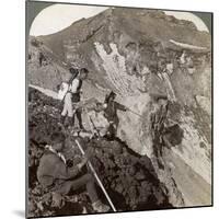 Peering from the Lava Encrusted Rim Down into Mount Fuji's (Fujiyama) Crater, Japan, 1904-Underwood & Underwood-Mounted Photographic Print
