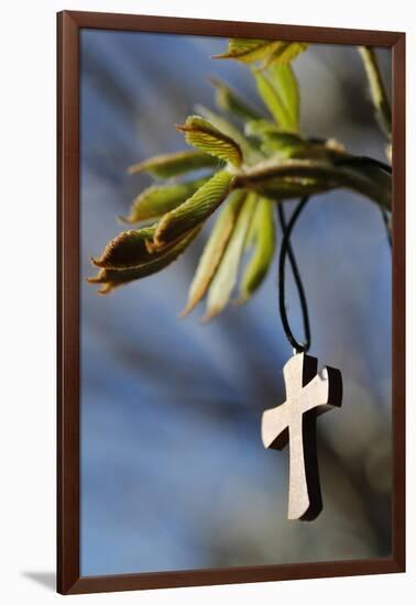 Pendant with cross on a young green chestnut leaf at springtime-null-Framed Giclee Print