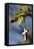 Pendant with cross on a young green chestnut leaf at springtime-null-Framed Stretched Canvas