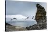 Penguins below dramatic rock formations, Half Moon Bay, South Sheltand Islands, Antarctica, Polar R-Michael Runkel-Stretched Canvas