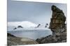 Penguins below dramatic rock formations, Half Moon Bay, South Sheltand Islands, Antarctica, Polar R-Michael Runkel-Mounted Photographic Print
