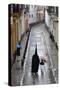 Penitents During Semana Santa (Holy Week) Along Rainy Street, Seville, Andalucia, Spain, Europe-Stuart Black-Stretched Canvas