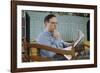 Pensive Man Reading Newspaper in Living Room-William P. Gottlieb-Framed Photographic Print