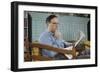 Pensive Man Reading Newspaper in Living Room-William P. Gottlieb-Framed Photographic Print