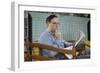 Pensive Man Reading Newspaper in Living Room-William P. Gottlieb-Framed Photographic Print