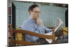 Pensive Man Reading Newspaper in Living Room-William P. Gottlieb-Mounted Photographic Print