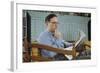 Pensive Man Reading Newspaper in Living Room-William P. Gottlieb-Framed Photographic Print