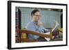 Pensive Man Reading Newspaper in Living Room-William P. Gottlieb-Framed Photographic Print