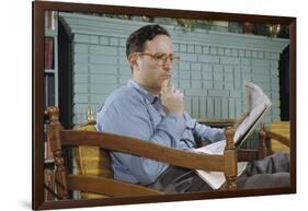 Pensive Man Reading Newspaper in Living Room-William P. Gottlieb-Framed Photographic Print