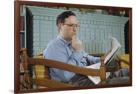 Pensive Man Reading Newspaper in Living Room-William P. Gottlieb-Framed Photographic Print