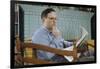 Pensive Man Reading Newspaper in Living Room-William P. Gottlieb-Framed Photographic Print