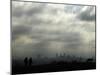 People and a Dog are Silhouetted Against a Landscape of Central London-null-Mounted Photographic Print