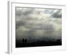 People and a Dog are Silhouetted Against a Landscape of Central London-null-Framed Photographic Print