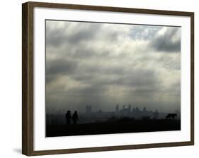 People and a Dog are Silhouetted Against a Landscape of Central London-null-Framed Photographic Print