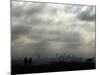 People and a Dog are Silhouetted Against a Landscape of Central London-null-Mounted Photographic Print