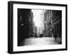 People and Horse Drawn Carts on Wall St, Where American Flags Fly from Buildings-George B^ Brainerd-Framed Photographic Print