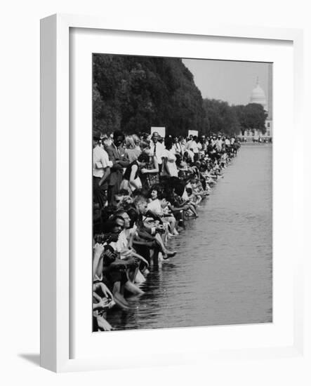 People at Civil Rights Rally Soaking their Feet in the Reflecting Pool at the Washington Monument-John Dominis-Framed Photographic Print