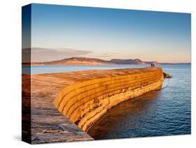 People at the end of The Cobb enjoying the evening light, Lyme Regis, Dorset, England-Jean Brooks-Stretched Canvas