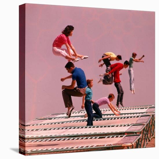 People Bouncing on Trampolines at Trampoline Center-J^ R^ Eyerman-Stretched Canvas