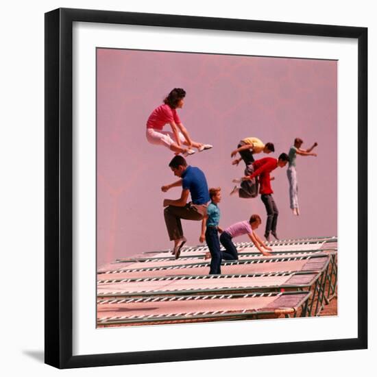 People Bouncing on Trampolines at Trampoline Center-J^ R^ Eyerman-Framed Photographic Print