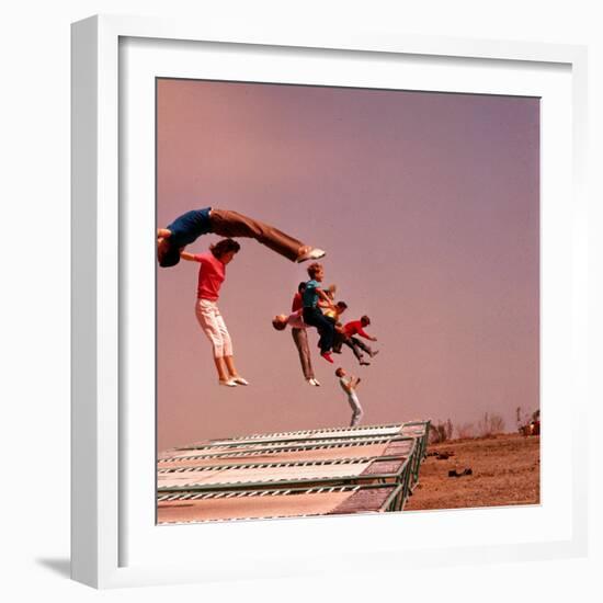 People Bouncing on Trampolines at Trampoline Center-J^ R^ Eyerman-Framed Photographic Print