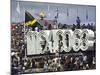 People Climbing and Sitting on a Mexico '68 Sign at the Summer Olympics-John Dominis-Mounted Photographic Print