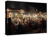 People eating at one of the stalls in Jemaa el-Fna at night, Marrakesh, Morocco-null-Stretched Canvas