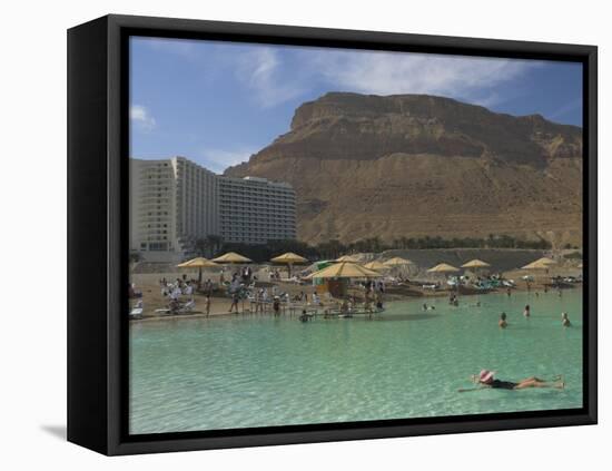 People Floating in the Sea and Hyatt Hotel and Desert Cliffs in Background, Dead Sea, Middle East-Eitan Simanor-Framed Stretched Canvas