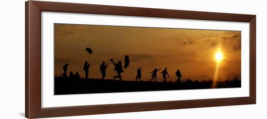 People Fly Kites as They are Silhouetted by the Setting Sun on Hampstead Heath in London-null-Framed Photographic Print