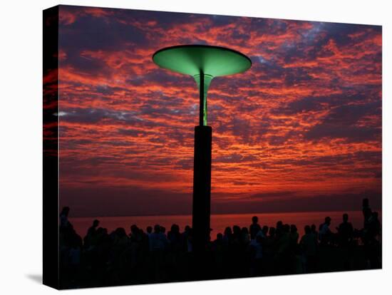 People Gather Along a Park Near the Sea Wall at the Scenic Manila Bay to Watch the Sunset-null-Stretched Canvas